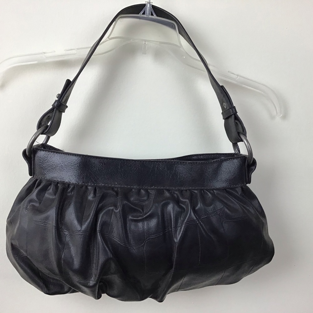 Vera Wang wide brass ring attached straps handbag.